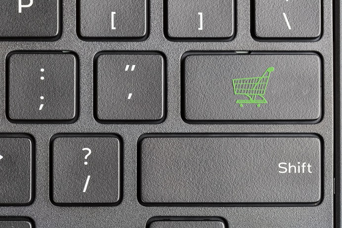 green shopping cart key on computer keyboard , online shopping concept